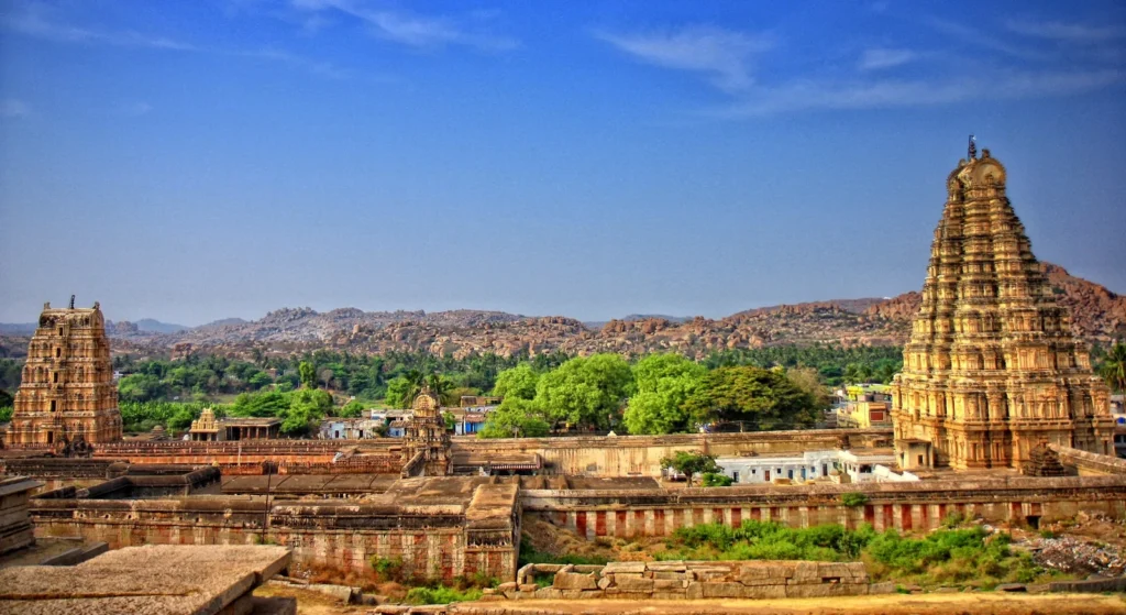 Virupaksha Temple complex at Hampi with stone structures and temple towers